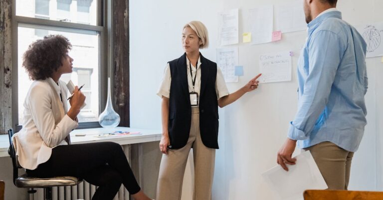 Professionals discussing project plans during a team meeting in a contemporary office