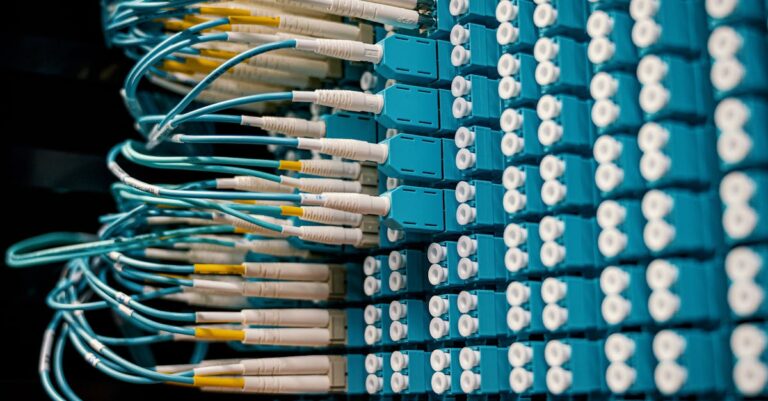Network patch panel with connected blue fiber optic cables for Microsoft Entra Internet Access proxy operations